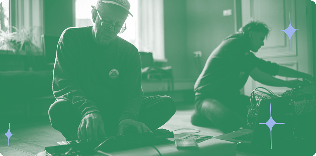 a photograph with green overlay of Julian and Jobbe making music